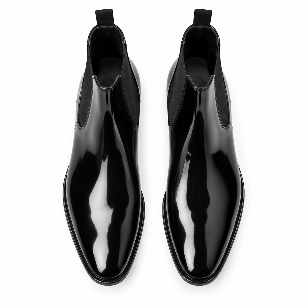 Black patent leather Chelsea Dress Boot pair flat lay by HappyWalk
